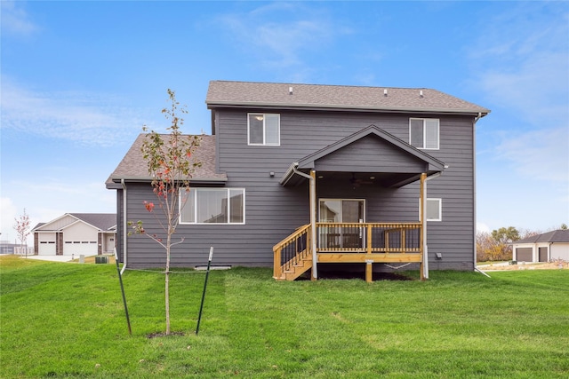 885 NW Frescott Cir, Waukee, IA 50263 - rear view of house featuring a deck, a lawn, and a ceiling fan