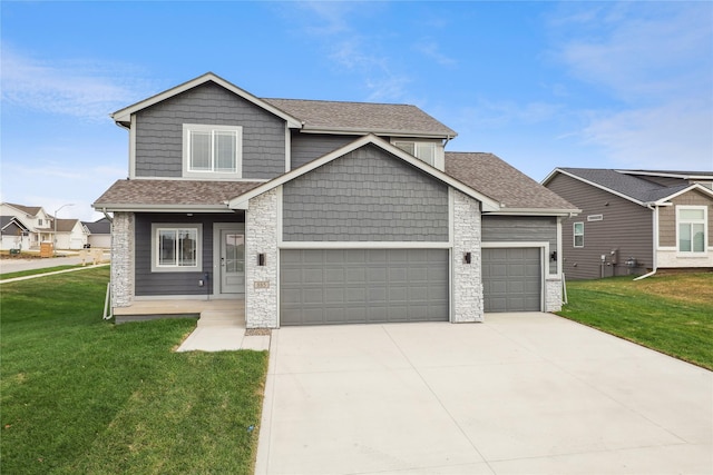 885 NW Frescott Cir, Waukee, IA 50263 - craftsman house with an attached garage, stone siding, a front lawn, and roof with shingles