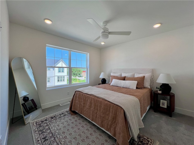 bedroom featuring ceiling fan and carpet