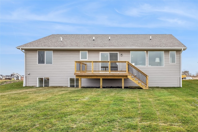 back of property featuring a yard and a deck