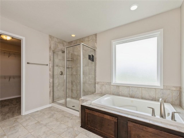 bathroom with separate shower and tub