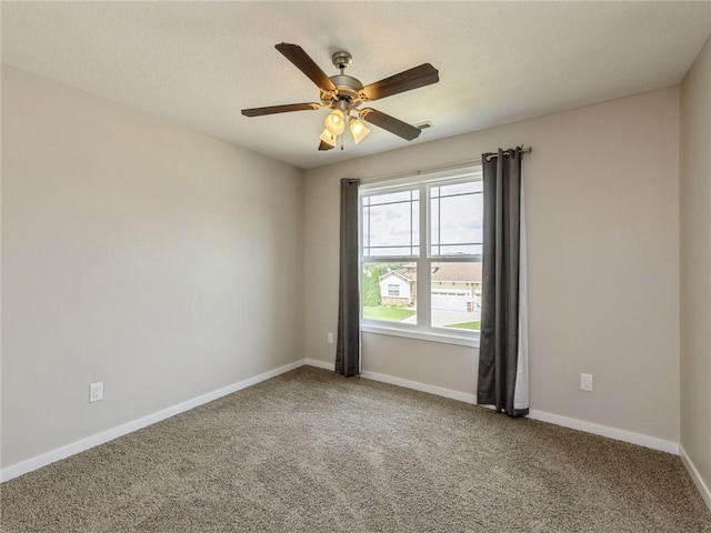 carpeted empty room with ceiling fan