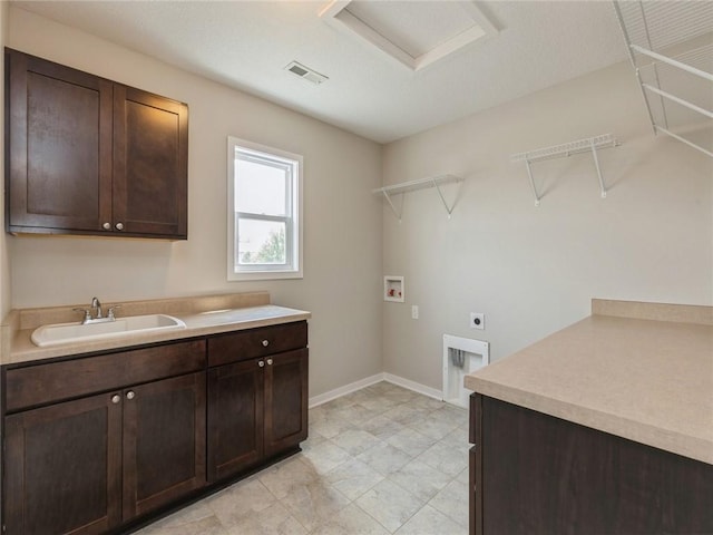 washroom with electric dryer hookup, cabinets, sink, and hookup for a washing machine