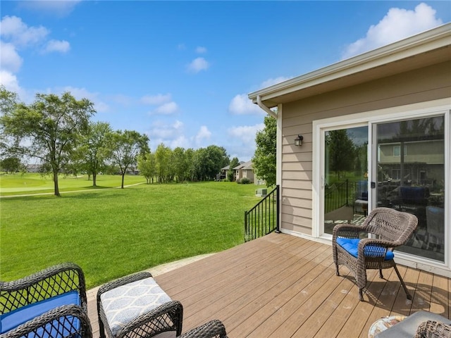 wooden terrace with a lawn