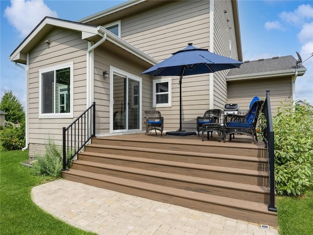 back of house with a wooden deck