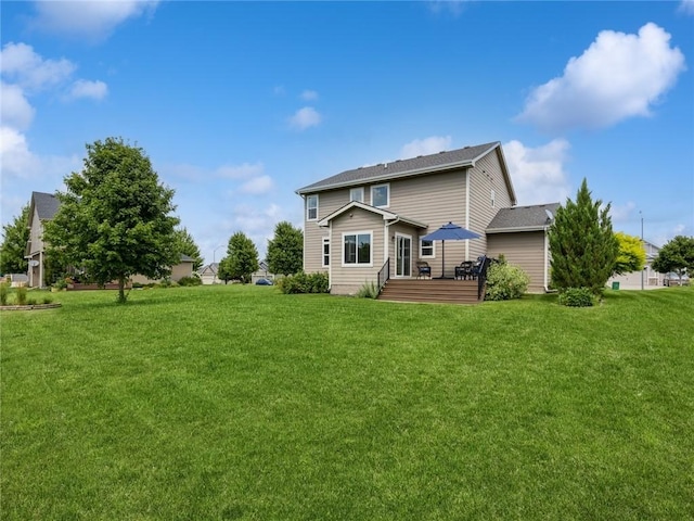 back of house with a yard and a wooden deck