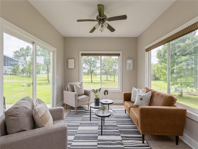 sunroom with plenty of natural light and ceiling fan