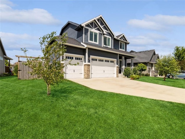 craftsman-style house featuring a garage and a front yard