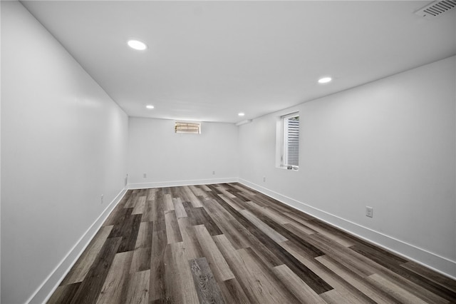 basement with dark wood-type flooring