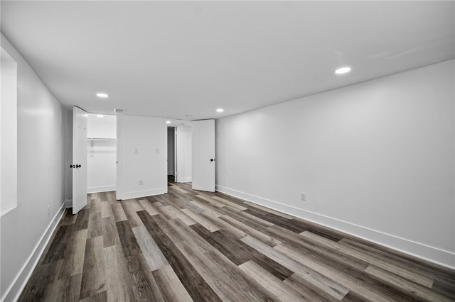 unfurnished room with wood-type flooring