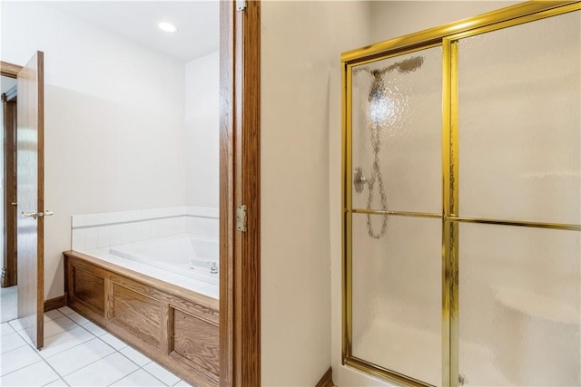 bathroom with tile patterned floors and independent shower and bath