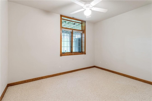 unfurnished room featuring carpet and ceiling fan