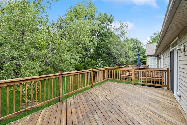 deck featuring a lawn