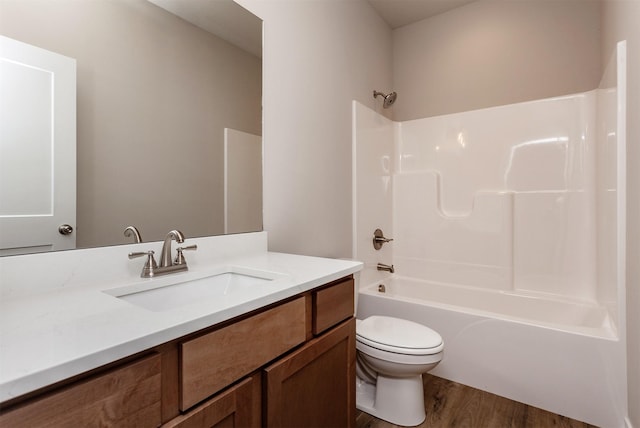 7807 SE 2nd St SE, Des Moines, IA 50320 - full bathroom featuring wood finished floors, vanity, and  shower combination