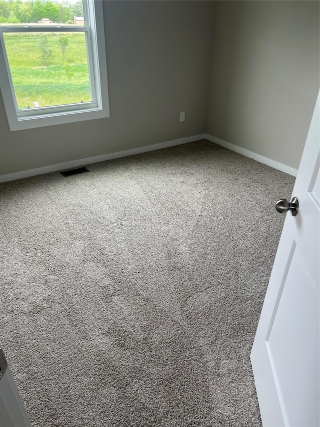 7807 SE 2nd St SE, Des Moines, IA 50320 - carpeted empty room featuring baseboards