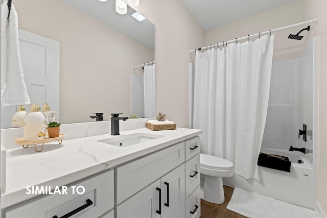 full bathroom with vanity, hardwood / wood-style floors, shower / tub combo with curtain, and toilet