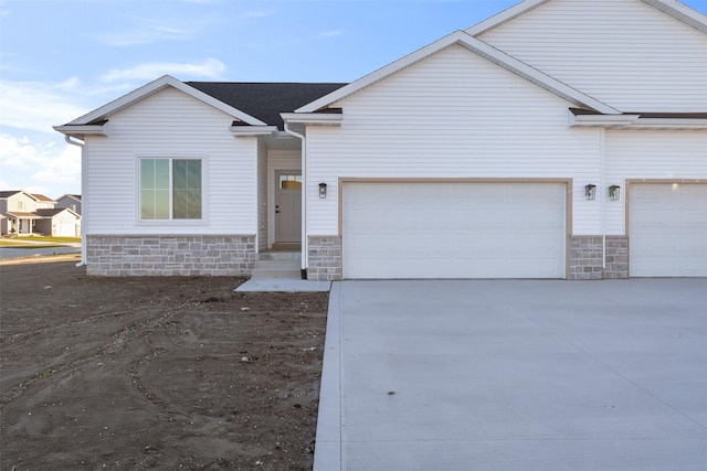 ranch-style house featuring a garage