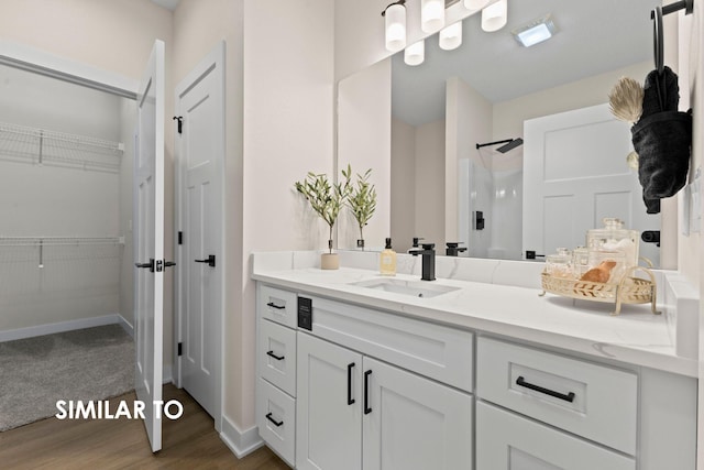 bathroom featuring hardwood / wood-style flooring and vanity