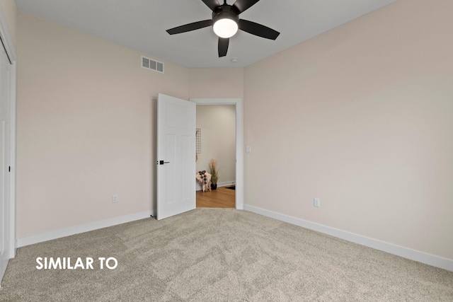 unfurnished bedroom with light carpet and ceiling fan