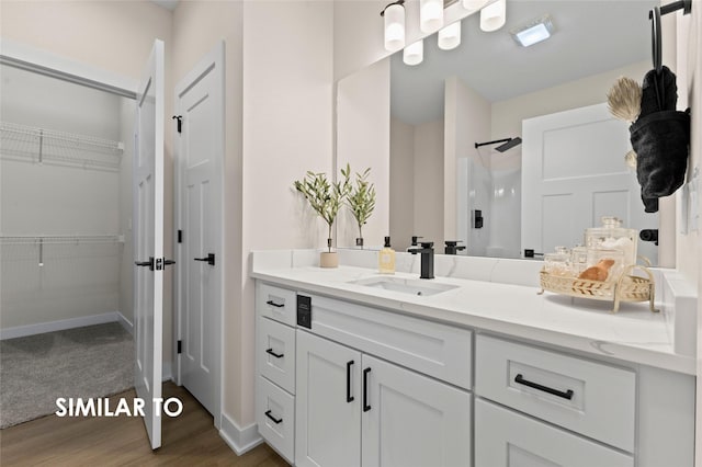 bathroom with hardwood / wood-style flooring and vanity