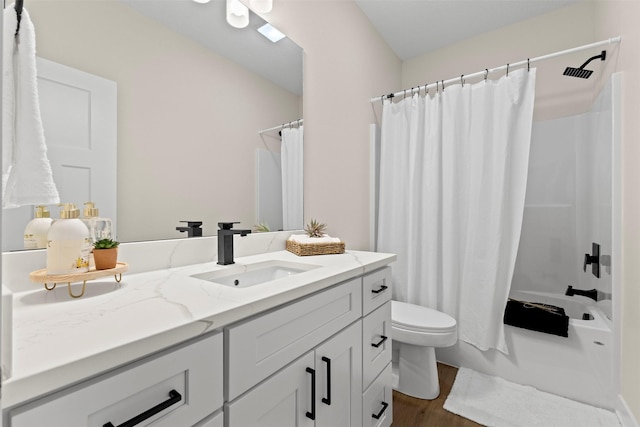 full bathroom featuring hardwood / wood-style flooring, vanity, toilet, and shower / bath combo with shower curtain