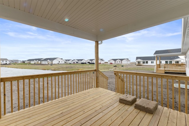 wooden terrace with a water view