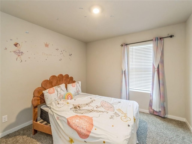 carpeted bedroom with baseboards