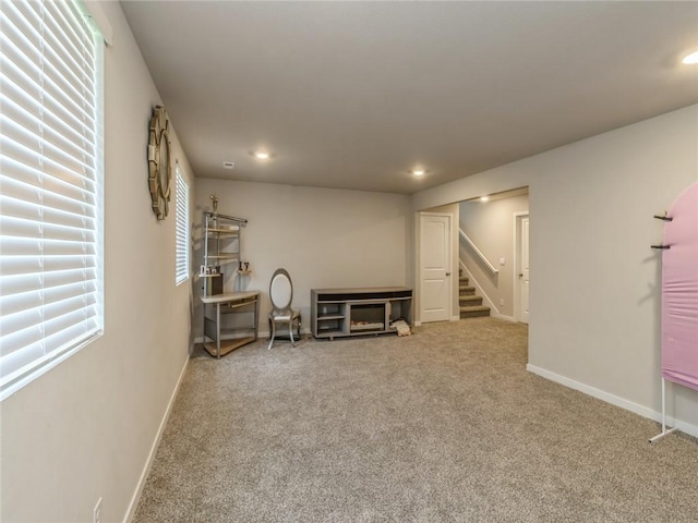 below grade area featuring recessed lighting, stairway, baseboards, and carpet flooring