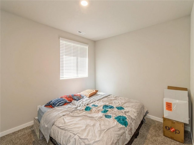 bedroom with visible vents, baseboards, and carpet floors