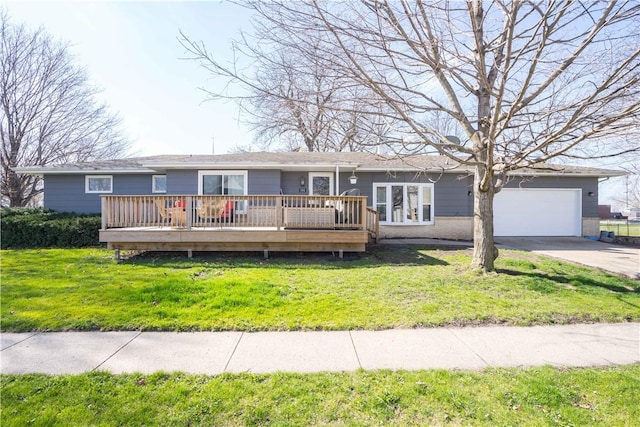 ranch-style house featuring a front yard, a garage, and a deck