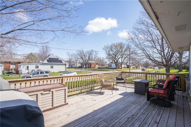 wooden terrace featuring grilling area