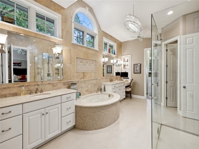 bathroom featuring tile patterned floors, ceiling fan, tile walls, and walk in shower