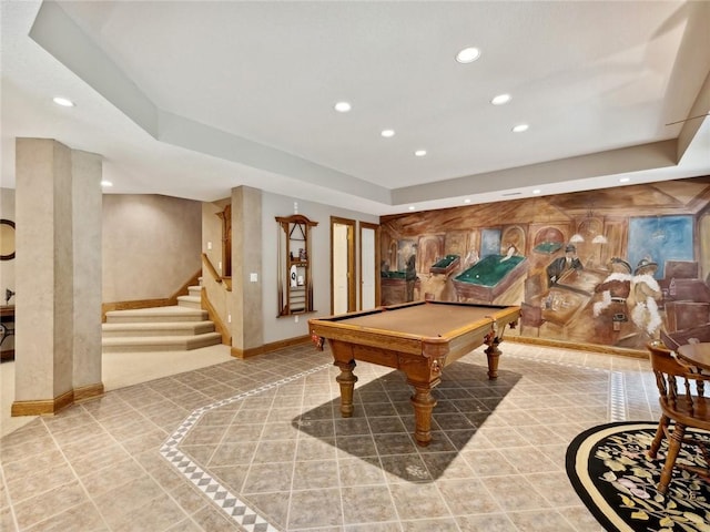 game room featuring a raised ceiling, light tile patterned flooring, and pool table