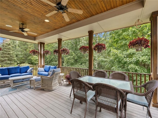 deck with outdoor lounge area and ceiling fan