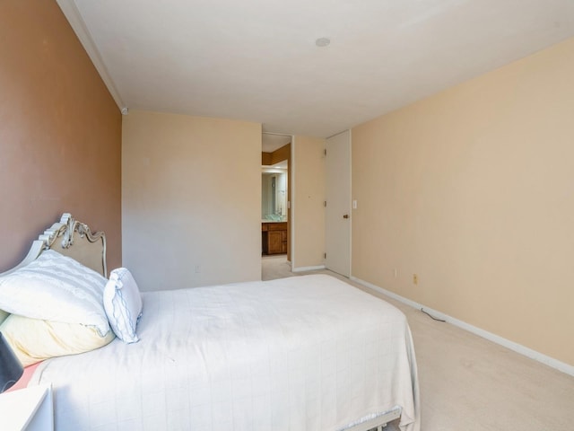 carpeted bedroom with ensuite bathroom