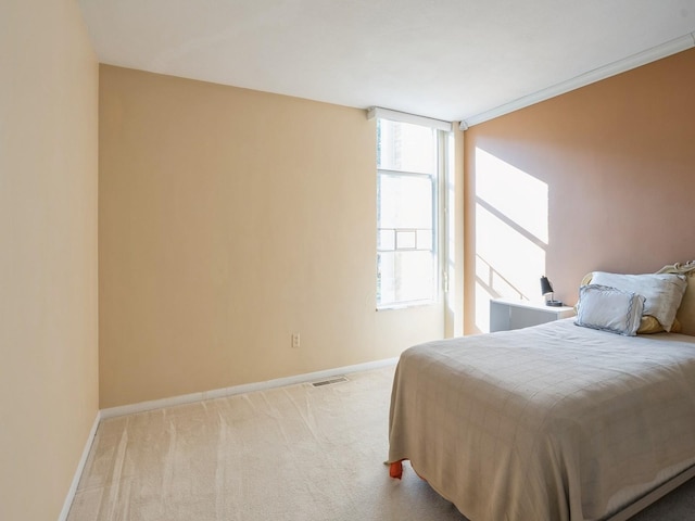 bedroom with light carpet