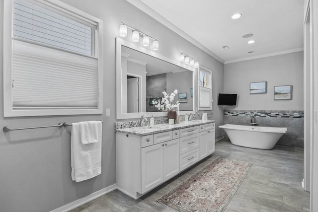 bathroom with a tub to relax in, vanity, tile walls, and ornamental molding