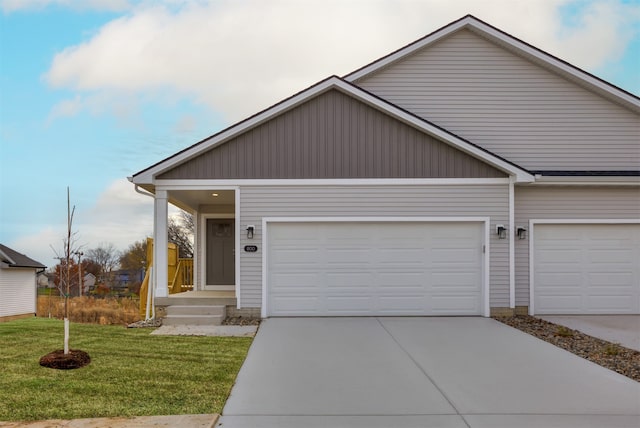 view of front of home featuring a garage and a front lawn