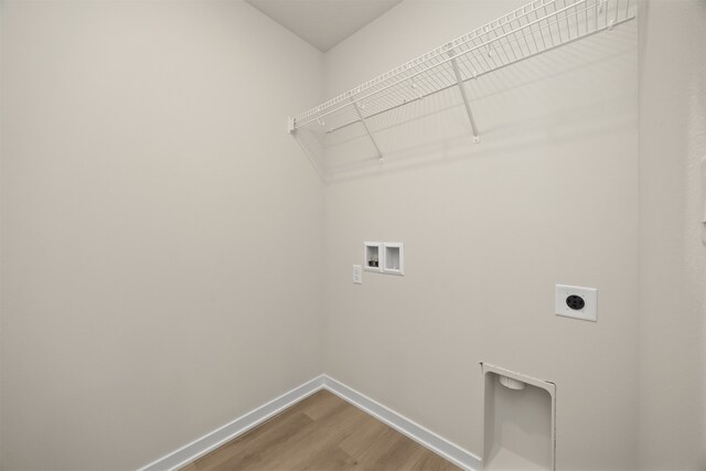 laundry area featuring hardwood / wood-style flooring, hookup for a washing machine, and hookup for an electric dryer