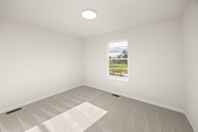 empty room with carpet flooring