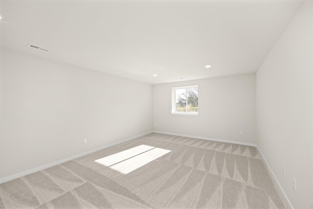 800 Linden St, Carlisle, IA 50047 - empty room featuring light carpet, recessed lighting, and baseboards