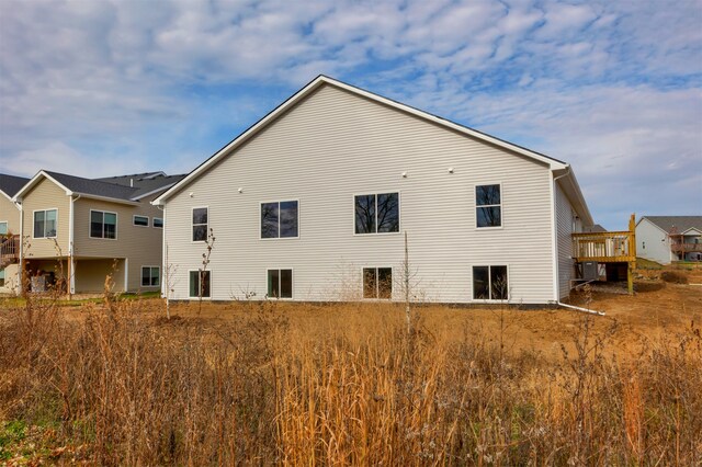 rear view of house with a wooden deck