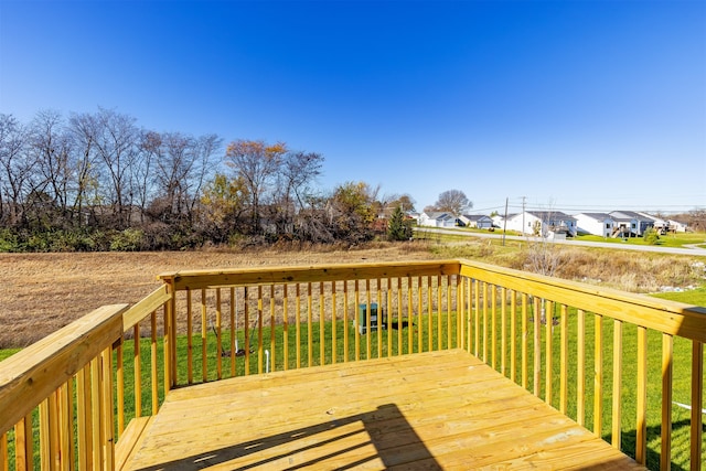 wooden terrace with a yard