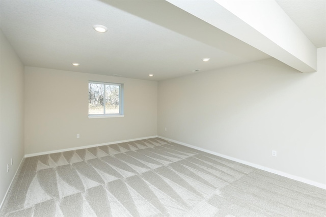 6570 NE 11th Ct, Des Moines, IA 50313 - unfurnished room with light carpet, recessed lighting, and baseboards