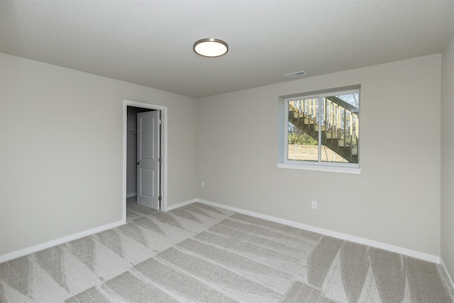 6570 NE 11th Ct, Des Moines, IA 50313 - spare room with light colored carpet and baseboards