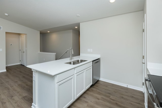 6570 NE 11th Ct, Des Moines, IA 50313 - kitchen featuring stainless steel dishwasher, a sink, a peninsula, light wood-style floors, and recessed lighting