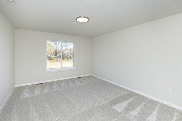 6570 NE 11th Ct, Des Moines, IA 50313 - carpeted empty room with baseboards