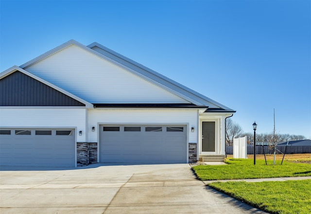 view of front facade with a garage and a front lawn