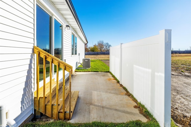 6573 NE 11th Ct, Des Moines, IA 50313 - view of patio / terrace featuring central air condition unit