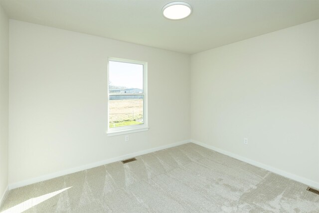 6573 NE 11th Ct, Des Moines, IA 50313 - empty room featuring carpet flooring and baseboards